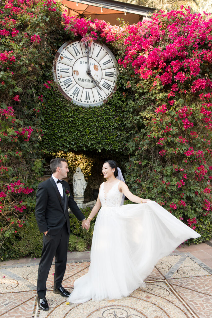 Bride and Groom in front of the Houdini clock