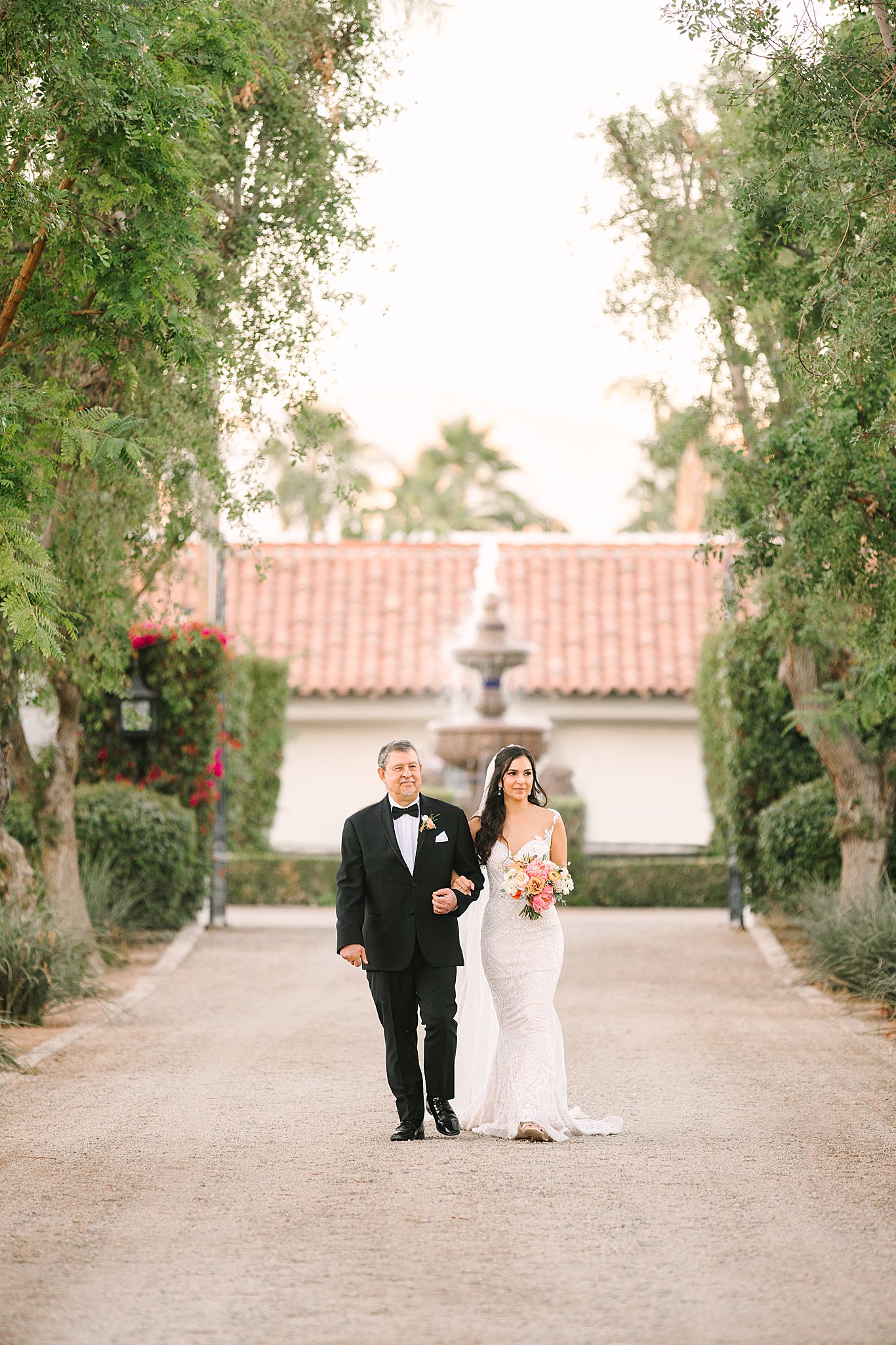 Romi walking down the aisle at Bougainvillea estate 