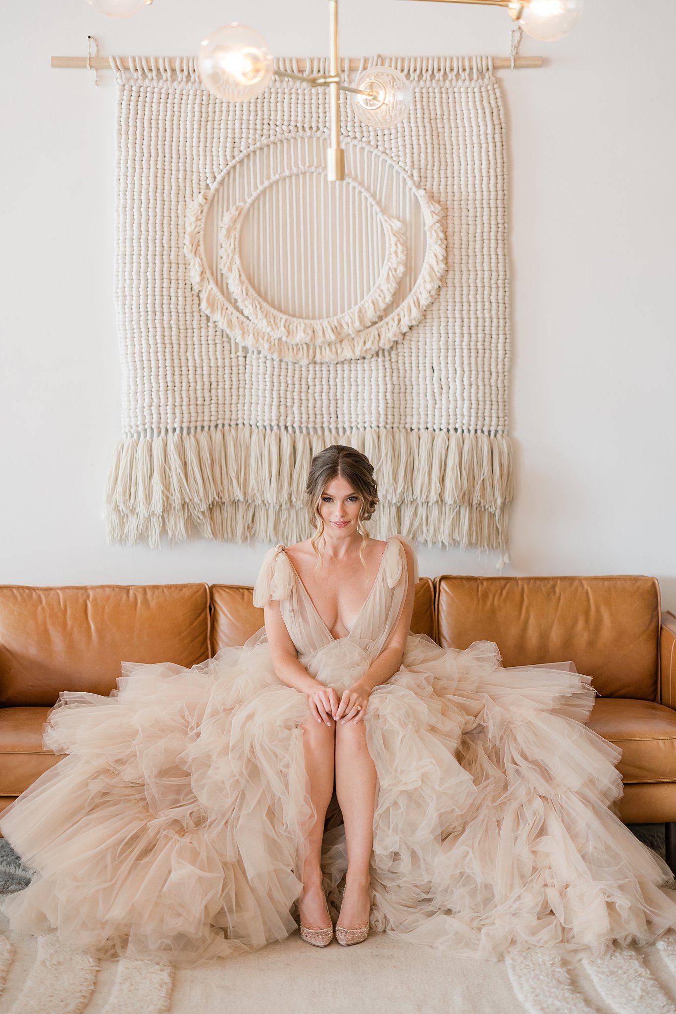 Bride sitting down in wedding gown