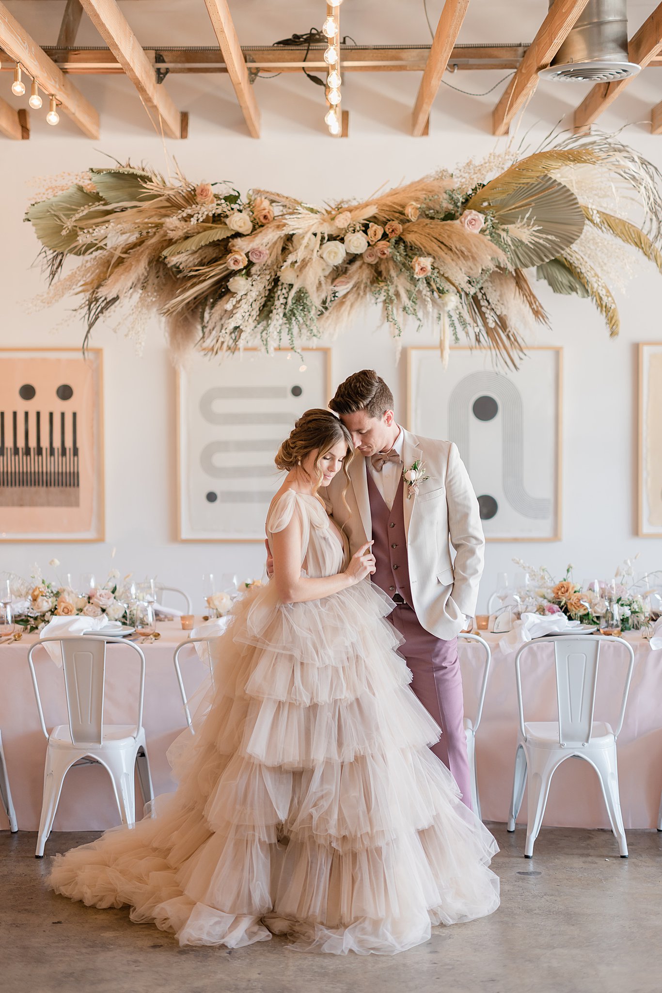 bride and groom in front of reception